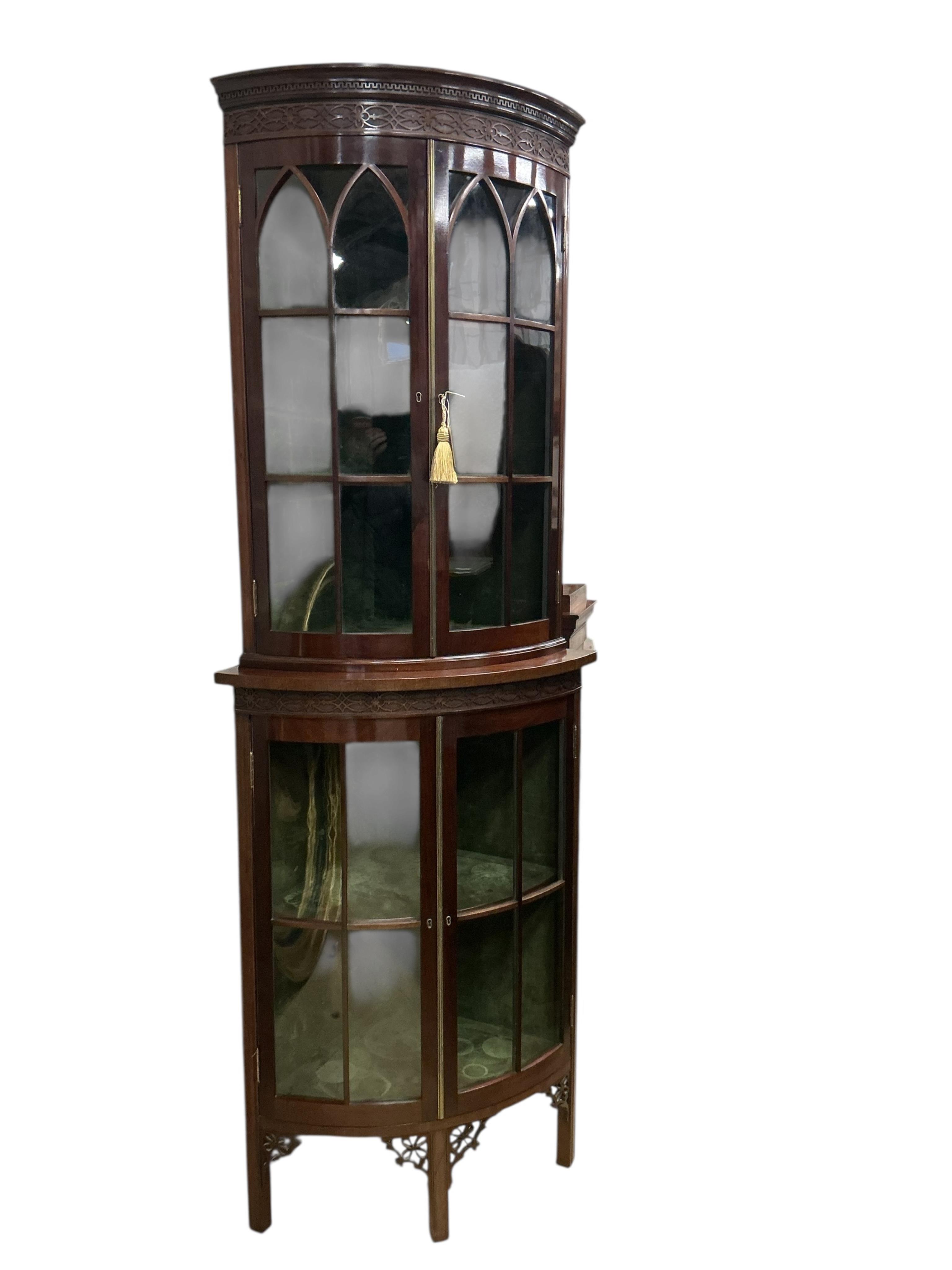 An Edwardian Chippendale Revival mahogany bowfront standing corner cupboard, width 76cm, depth 52cm, height 209cm